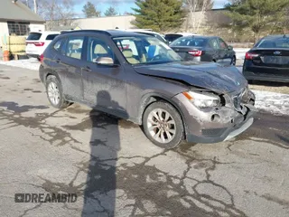 2014 BMW X1 xDrive28i with VIN WBAVL1C56EVY19340, listed as a IAAI auction lot 41340436 with 85,867 mi miles. Bid and sale history available at carsss.com. Image 1.