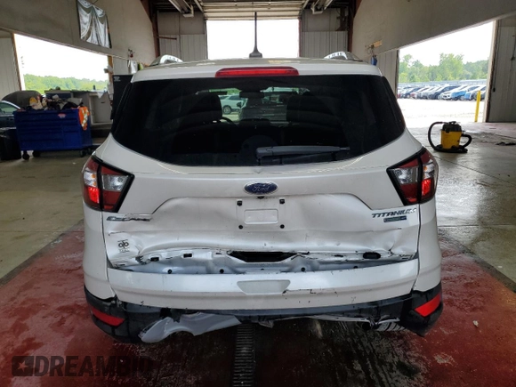 2018 Ford Escape Titanium с VIN 1FMCU9J90JUB30658, выставлен на аукционе Copart как лот 64001665 с пробегом 61 970 миль миль и Списание • Salvage title. История ставок и продаж доступна на DreamBid. Изображение 6.