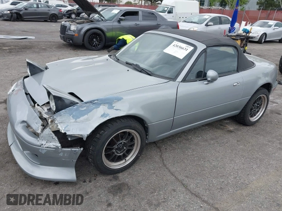 1992 Mazda MX-5 Miata z VIN JM1NA3514N0314487, wystawiony jako IAAI lot #42036631 z przebiegiem 125 882 mil mil oraz . Historia ofert i sprzedaży dostępna na DreamBid. Obrazek 2.