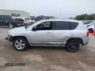 2011 Jeep Compass with VIN 1J4NT1FA7BD142600, listed as a IAAI auction lot 41590661 with 266,600 mi miles. Bid and sale history available at carsss.com. Image 15.