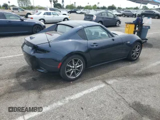 2021 Mazda MX-5 Miata Grand Touring with VIN JM1NDAM70M0460532, listed as a Copart auction lot 58828045 with 70,269 mi miles and Salvage title. Bid and sale history available at DreamBid. Image 3.