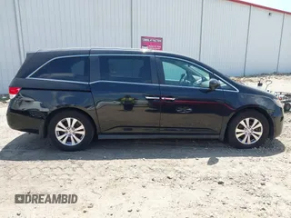 2014 Honda Odyssey EX-L with VIN 5FNRL5H66EB062158, listed as a IAAI auction lot 42072020 with 211,278 mi miles and . Bid and sale history available at carsss.com. Image 13.