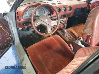 1982 Datsun 280ZX z VIN JN1HZ04S5CX431646, wystawiony jako Copart lot #55607255 z przebiegiem 173 546 mil mil oraz Tytuł czysty. Historia ofert i sprzedaży dostępna na DreamBid. Obrazek 8.