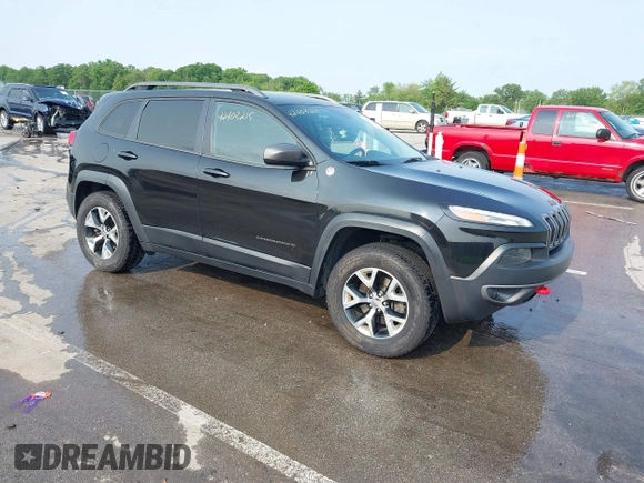 2015 Jeep Cherokee Trailhawk with VIN 1C4PJMBS6FW786622, listed as a IAAI auction lot 42403215 with 148,205 mi miles and . Bid and sale history available at DreamBid. Image 1.