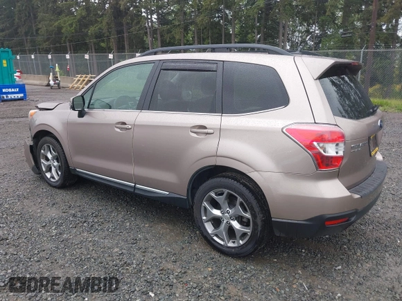 2015 Subaru Forester Touring with VIN JF2SJAUC1FH457069, listed as a IAAI auction lot 42293542 with 71,689 mi miles and . Bid and sale history available at DreamBid. Image 3.