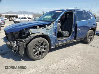 2020 BMW X5 sDrive40i with VIN 5UXCR4C06LLT19636, listed as a Copart auction lot 49357365 with 67,165 mi miles and Salvage title. Bid and sale history available at DreamBid. Image 1.