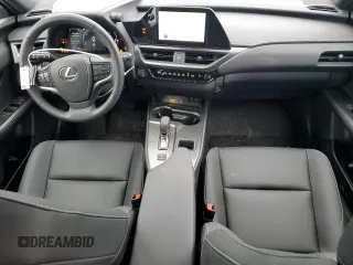 2025 Lexus UX with VIN JTHUCJDH3S2001129, listed as a Copart auction lot 65140554 with 875 mi miles and Salvage Title. Bid and sale history available at carsss.com. Image 8.