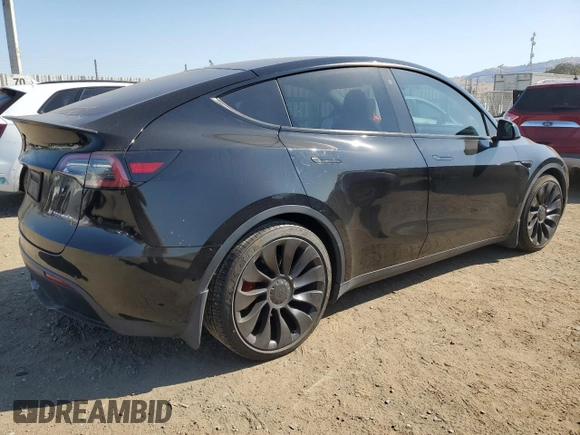 2022 Tesla Model Y Performance with VIN 7SAYGDEF1NF486218, listed as a Copart auction lot 63127435 with 99,302 mi miles and Salvage title. Bid and sale history available at DreamBid. Image 3.