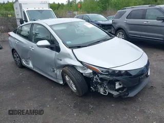 2021 Toyota Prius LE z VIN JTDKAMFP9M3179242, wystawiony jako IAAI lot #42313383 z przebiegiem 80 317 mil mil oraz . Historia ofert i sprzedaży dostępna na DreamBid. Obrazek 1.