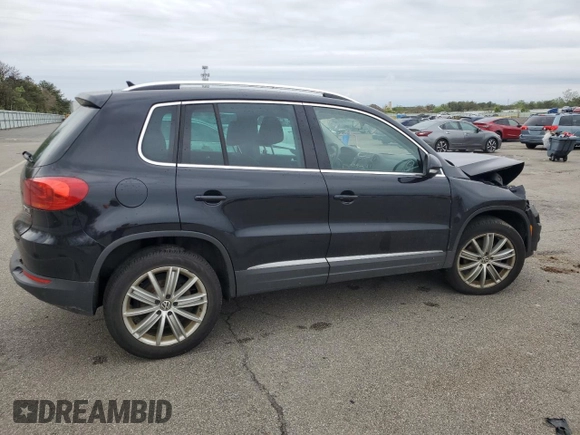 2014 Volkswagen Tiguan S z VIN WVGBV3AX5EW554500, wystawiony jako Copart lot #57016775 z przebiegiem 91 101 mil mil oraz Szkoda całkowita • Salvage title. Historia ofert i sprzedaży dostępna na DreamBid. Obrazek 3.