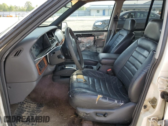 1996 Jeep Grand Cherokee Laredo z VIN 1J4EX58S3TC144191, wystawiony jako Copart lot #53153495 z przebiegiem 197 853 mil mil oraz Szkoda całkowita • Salvage title. Historia ofert i sprzedaży dostępna na DreamBid. Obrazek 7.