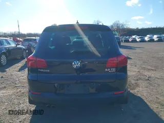 2014 Volkswagen Tiguan S z VIN WVGBV3AX4EW581302, wystawiony jako IAAI lot #41033175 z przebiegiem 69 791 mil mil oraz . Historia ofert i sprzedaży dostępna na DreamBid. Obrazek 16.