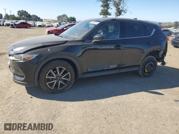 2018 Mazda CX-5 Grand Touring с VIN JM3KFADM2J1310339, выставлен на аукционе Copart как лот 64705245 с пробегом 63 927 миль миль и Списание • Salvage title. История ставок и продаж доступна на DreamBid. Изображение 1.