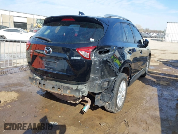 2014 Mazda CX-5 Sport with VIN JM3KE4BE6E0388909, listed as a IAAI auction lot 41876514 with 196,882 mi miles. Bid and sale history available at carsss.com. Image 4.