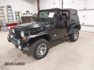 2002 Jeep Wrangler Sport with VIN 1J4FA49S02P704741, listed as a IAAI auction lot 41759558 with 191,126 mi miles. Bid and sale history available at carsss.com. Image 2.