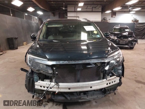 2016 Honda Pilot Touring with VIN 5FNYF6H98GB035226, listed as a IAAI auction lot 42022957 with 103,842 mi miles and . Bid and sale history available at DreamBid. Image 13.