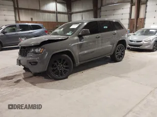 2019 Jeep Grand Cherokee Laredo E with VIN 1C4RJFAG9KC667394, listed as a IAAI auction lot 41316264 with 55,156 mi miles. Bid and sale history available at carsss.com. Image 2.