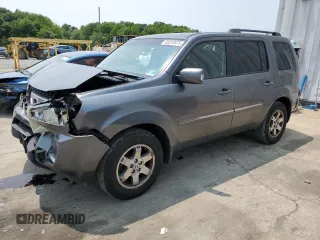2010 Honda Pilot Touring z VIN 5FNYF4H84AB039843, wystawiony jako Copart lot #60310575 z przebiegiem 212 376 mil mil oraz Szkoda całkowita • Salvage title. Historia ofert i sprzedaży dostępna na DreamBid. Obrazek 1.
