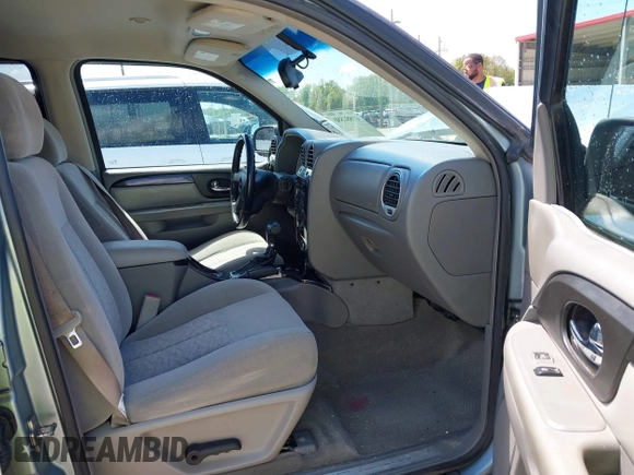 2006 GMC Envoy SLE with VIN 1GKDS13S362310613, listed as a IAAI auction lot 41881880 with 202,893 mi miles. Bid and sale history available at carsss.com. Image 5.