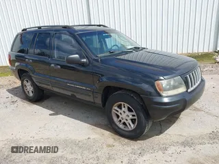 2004 Jeep Grand Cherokee Laredo with VIN 1J4GX48S14C156571, listed as a IAAI auction lot 42511342 with 222,371 mi miles and . Bid and sale history available at DreamBid. Image 1.