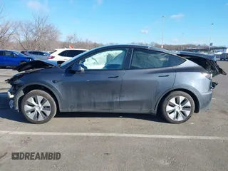 2020 Tesla Model Y Long Range with VIN 5YJYGDEE4LF030103, listed as a IAAI auction lot 41328929 with 64,896 mi miles and . Bid and sale history available at DreamBid. Image 14.