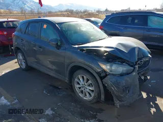 2014 Mazda CX-5 Grand Touring with VIN JM3KE2DY1E0421326, listed as a IAAI auction lot 41330794 with 127,589 mi miles. Bid and sale history available at carsss.com. Image 1.