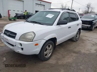 2006 Hyundai Tucson GL with VIN KM8JM12BX6U467288, listed as a IAAI auction lot 41679827 with 146,973 mi miles. Bid and sale history available at carsss.com. Image 2.