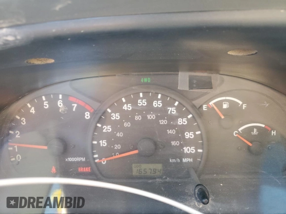 1999 Suzuki Grand Vitara JLX z VIN JS3TD62V0X4113058, wystawiony jako Copart lot #80089884 z przebiegiem 165 794 mil mil oraz Szkoda całkowita • Salvage title. Historia ofert i sprzedaży dostępna na DreamBid. Obrazek 9.