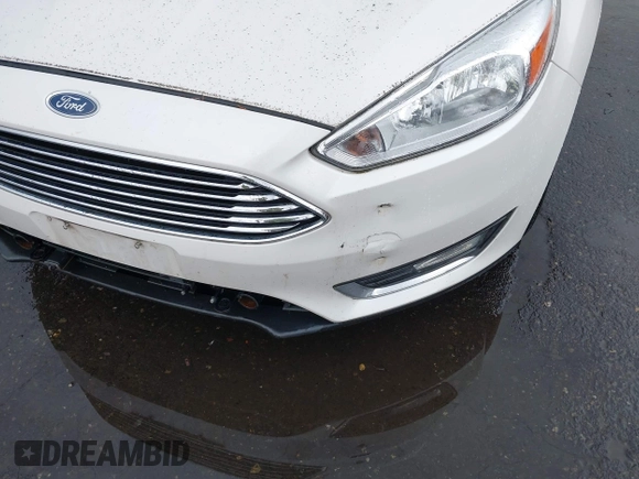 2015 Ford Focus Titanium z VIN 1FADP3N28FL262273, wystawiony jako IAAI lot #42552995 z przebiegiem 60 504 mil mil oraz . Historia ofert i sprzedaży dostępna na DreamBid. Obrazek 6.
