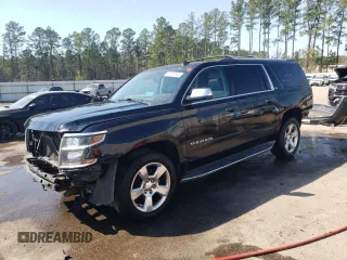 2015 Chevrolet Suburban LTZ with VIN 1GNSKKKC2FR210780, listed as a Copart auction lot 47207445 with 163,448 mi miles and Salvage Title. Bid and sale history available at carsss.com. Image 1.