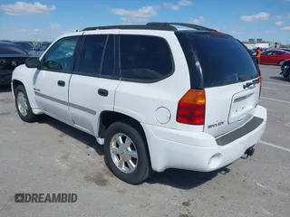 2006 GMC Envoy SLE with VIN 1GKDT13SX62258586, listed as a IAAI auction lot 42045967 with 143,225 mi miles. Bid and sale history available at carsss.com. Image 3.