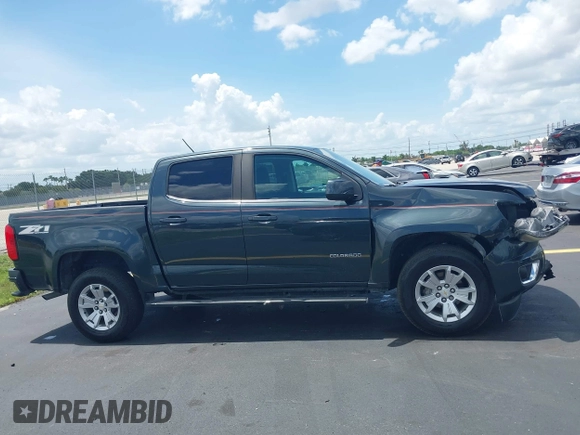 2018 Chevrolet Colorado 2WD LT z VIN 1GCGSCEA9J1137767, wystawiony jako IAAI lot #42389519 z przebiegiem 116 547 mil mil oraz . Historia ofert i sprzedaży dostępna na DreamBid. Obrazek 13.