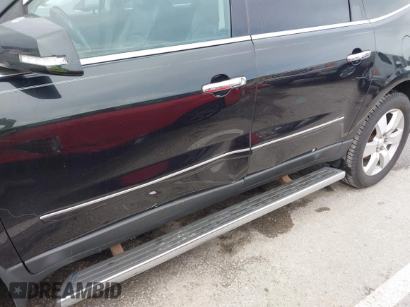 2014 Chevrolet Traverse LTZ with VIN 1GNKRJKD1EJ203282, listed as a IAAI auction lot 41984380 with 219,819 mi miles and . Bid and sale history available at DreamBid. Image 6.