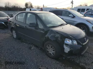 2012 Suzuki SX4 LE with VIN JS2YC5A32C6302316, listed as a Copart auction lot 81703544 with 87,411 mi miles and Salvage Title. Bid and sale history available at carsss.com. Image 4.