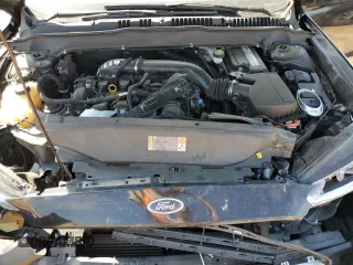 2016 Ford Fusion Titanium z VIN 3FA6P0K98GR151640, wystawiony jako Copart lot #73254594 z przebiegiem 145 473 mil mil oraz Szkoda całkowita • Salvage title. Historia ofert i sprzedaży dostępna na DreamBid. Obrazek 12.