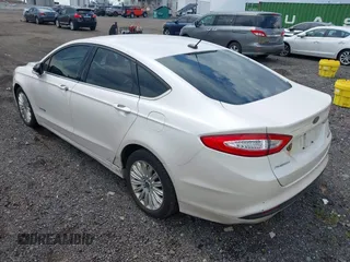 2014 Ford Fusion SE Hybrid z VIN 3FA6P0LU3ER391680, wystawiony jako IAAI lot #42643934 z przebiegiem 102 578 mil mil oraz . Historia ofert i sprzedaży dostępna na DreamBid. Obrazek 3.