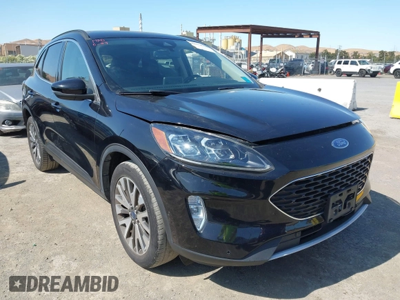 2020 Ford Escape Titanium z VIN 1FMCU9J97LUB18350, wystawiony jako IAAI lot #42574736 z przebiegiem 82 551 mil mil oraz . Historia ofert i sprzedaży dostępna na DreamBid. Obrazek 1.