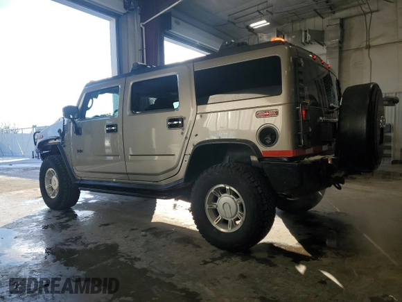 2003 Hummer H2 with VIN 5GRGN23U53H101713, listed as a Copart auction lot 85216034 with 189,549 mi miles and Non Repairable. Bid and sale history available at carsss.com. Image 2.