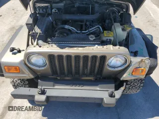 2002 Jeep Wrangler Sport with VIN 1J4FA49S72P765939, listed as a Copart auction lot 50615035 with 210,516 mi miles and Salvage Title. Bid and sale history available at carsss.com. Image 12.