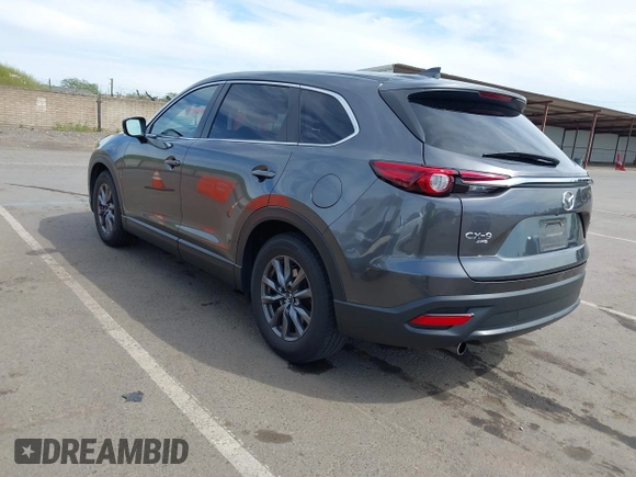 2021 Mazda CX-9 Sport with VIN JM3TCBBY7M0520437, listed as a IAAI auction lot 42022562 with 77,063 mi miles and . Bid and sale history available at DreamBid. Image 3.