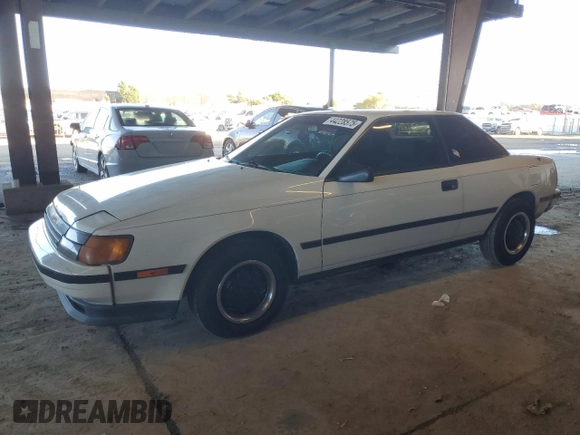 1986 Toyota Celica z VIN JT2ST64CXG7013064, wystawiony jako Copart lot #44228575 z przebiegiem 101 881 mil mil oraz Szkoda całkowita • Salvage title. Historia ofert i sprzedaży dostępna na DreamBid. Obrazek 1.