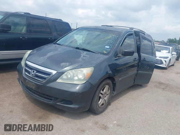 2006 Honda Odyssey LX with VIN 5FNRL38206B120381, listed as a IAAI auction lot 42058872 with 165,217 mi miles. Bid and sale history available at carsss.com. Image 2.