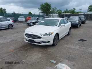 2017 Ford Fusion Titanium with VIN 3FA6P0K96HR115561, listed as a IAAI auction lot 42596030 with 187,865 mi miles and . Bid and sale history available at DreamBid. Image 2.
