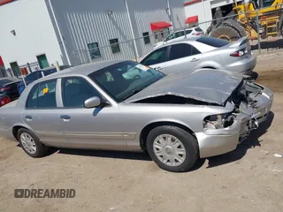 2005 Mercury Grand Marquis GS with VIN 2MEFM74W05X653375, listed as a IAAI auction lot 41995502 with 200,083 mi miles and . Bid and sale history available at DreamBid. Image 13.