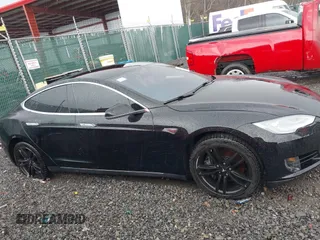 2014 Tesla Model S 60 with VIN 5YJSA1H18EFP28053, listed as a IAAI auction lot 41191521 with 82,207 mi miles and . Bid and sale history available at DreamBid. Image 12.