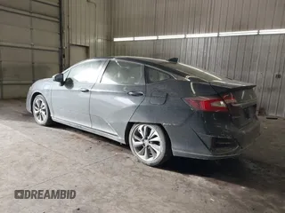 2018 Honda Clarity Touring z VIN JHMZC5F39JC002521, wystawiony jako IAAI lot #41428968 z przebiegiem 64 014 mil mil oraz . Historia ofert i sprzedaży dostępna na DreamBid. Obrazek 3.