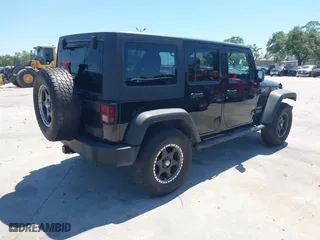 2013 Jeep Wrangler Unlimited Sport with VIN 1C4BJWDG7DL583686, listed as a IAAI auction lot 42037650 with 122,408 mi miles. Bid and sale history available at carsss.com. Image 4.