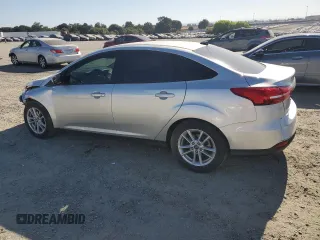 2018 Ford Focus SE with VIN 1FADP3FE4JL308909, listed as a Copart auction lot 61489005 with 58,613 mi miles and Salvage title. Bid and sale history available at DreamBid. Image 2.