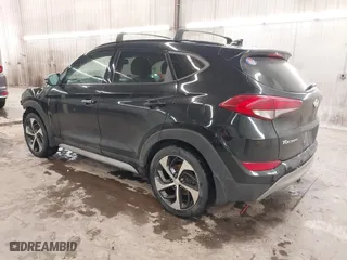 2018 Hyundai Tucson Value with VIN KM8J3CA28JU648236, listed as a IAAI auction lot 41161221 with 104,057 mi miles. Bid and sale history available at carsss.com. Image 3.