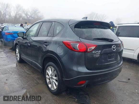 2014 Mazda CX-5 Grand Touring with VIN JM3KE4DY0E0392476, listed as a IAAI auction lot 41419144 with 89,245 mi miles and . Bid and sale history available at carsss.com. Image 3.